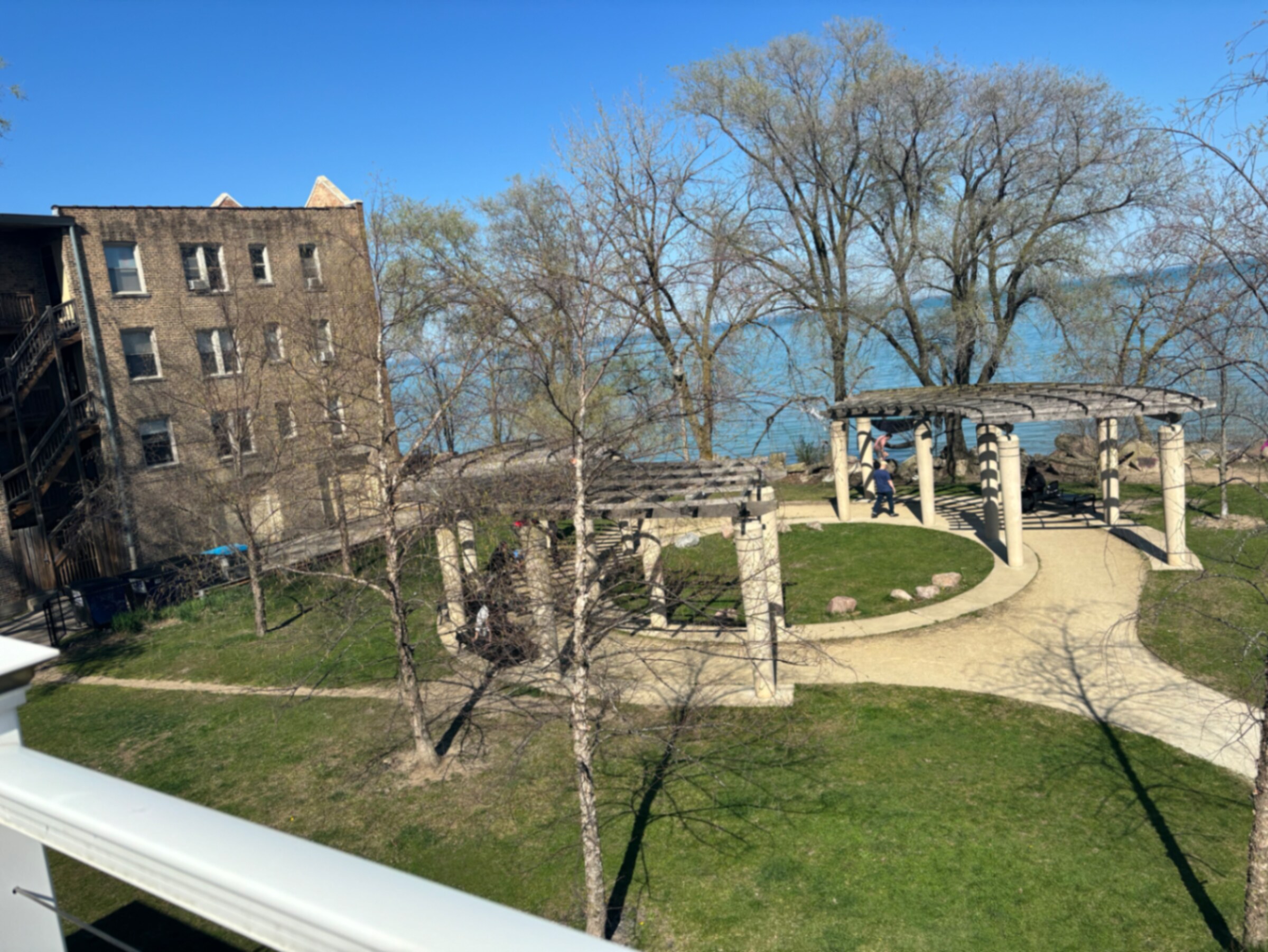 Lakefront pergola and lawn next to Albion Beach